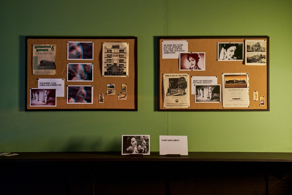 Installation view of Dark Circles at FACT Liverpool, showing cork boards and text works.