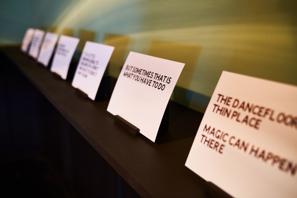 Installation view of Dark Circles at FACT Liverpool, showing text works on paper.